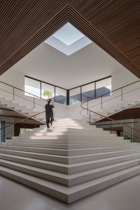 A sculptural staircase in the community centre mirrors an external staircase. Staircase Sculpture, Sculptural Staircase, Rooftop Planters, Central Staircase, Staircase Architecture, Phuket City, Drawing House Plans, House Projects Architecture, Rooftop Gardens