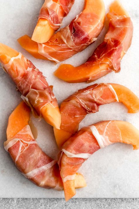 A fave Italian appetizer or snack: Prosciutto-Wrapped Cantaloupe! Rich, salty prosciutto wrapped around juicy cantaloupe melon & drizzled with sweet & tangy reduced balsamic. Made with 3 ingredients in 10 minutes, this is the EASIEST prosciutto & melon appetizer & it's perfect for summer parties or a quick & easy nibble on a hot summer night. #prosciuttomelon #prosciuttocantaloupe #easyappetizerrecipes #appetizers #italianrecipes #authenticitalianrecipes #appetizersnacks #prosciuttorecipes Cantaloupe With Prosciutto, Melon Appetizer, Proscuitto Appetizers, Prosciutto Melon, Italian Appetizer, Prosciutto Recipes, Prosciutto Wrapped, Italian Appetizers, Italian Recipes Authentic