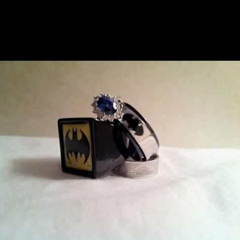 My engagement ring (sapphire) conquering my fake out ring (silver batman), proposal to propose ring (yellow batman), and our promise ring (silver)... Can't wait to get our wedding bands! Batman Proposal, Batman Wedding Rings, Promise Ring Silver, Batman Wedding, Engagement Ring Sapphire, Vintage Engagement Ring Settings, Milgrain Engagement Ring, Ruby Wedding Band, Gold Wedding Bands Women