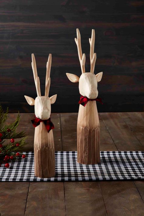 Create the coziest Christmas environment with our Small Decorative Deer Sitter. The carved wooden deer sitter features bark-like texture. The deer sitter features the most unique details and the reindeer is wearing a cotton bow. Make sure to pair with our other decorative deer sitters for a matching set. | Mud Pie Small Decorative Deer Sitter in Brown | Pine Wood Christmas Environment, Wooden Deer, Simple Wood Carving, Deer Ornament, Wood Stars, Plaid Bow, Mud Pie, Christmas Wood, Cozy Christmas