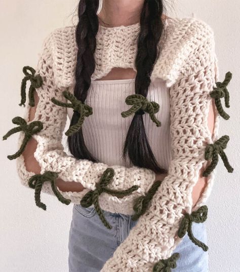 How To Make Crochet Bow Shrug Online | JOANN Crochet Crop Shrug, Shruggie Crochet Pattern, Cute Crochet Shrug, Shruggie Crochet, Crochet Shrug Outfit Aesthetic, Pink Crochet Shrug, Crochet Flare Sleeve Shrug, Shrug Outfit, Scarf Shrug