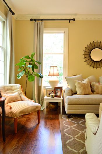 love the striped chair! Decorating Yellow Walls, Living Room Light Yellow Walls, Curtains With Yellow Walls, Yellow Painted Living Room, What Color Curtains Go With Yellow Walls, Magnolia Walls Living Room, Pale Yellow Walls Living Room Decor, Soft Yellow Living Room, Yellow Wall Curtain Ideas