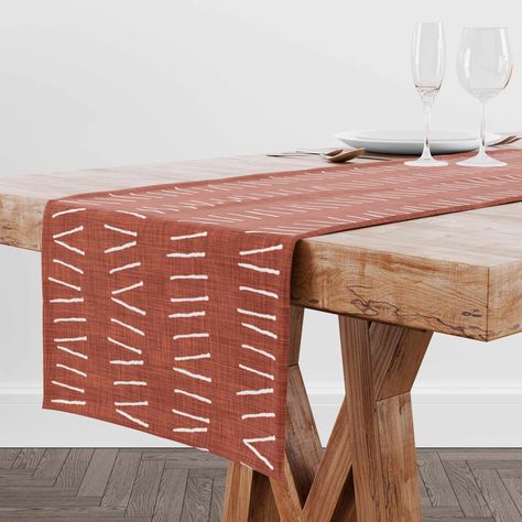 Dress your dining table up with this beautiful mudcloth print table runner in dark terracotta and white. The trendy boho design adds the perfect touch to your dining room decor for a look you'll love.  DETAILS Color: dark clay Durable lightweight polyester twill Sizes: 16 x 72 and 16 x 90 inches Design on the front, white back Hemmed edges on all four sides Machine washable Made to order in 3-7 business days Original design by Luv Unique Home Custom printed by our partner in North Carolina, USA Boho Dinner Table, Dark Terracotta, Farmhouse Table Runner, Bohemian Table, Boho Table Runner, Farmhouse Table Runners, Fun Office, Fun Organization, Bohemian Farmhouse