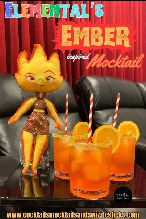 this image shows three orangey-red drinks with orange wheel garnish and red striped staws with Elementals Ember plush next to them set in a home theater. Disney Themed Drinks, Disney Themed Party, Disney Movie Night Menu, Disney Themed Movie Night, Disney Movie Night Food, Disney Inspired Cocktails, Disney Cocktails, Disney Movie Night Dinner, 4de Verjaardag