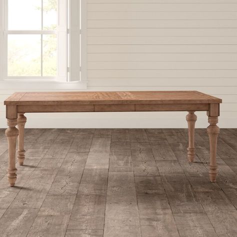 Deck out your dining room in modern farmhouse flair with this rectangular dining table. Crafted from solid wood with oak veneers, this piece sports a light oak finish with wood grain details for a rustic look that’s still versatile enough to complement most color palettes. Turned legs offer up a traditional touch, while an included leaf expands its top to offer enough surface space to seat six comfortably during casual family meals and dinner parties alike. Assembly is required. French Country Dining Rooms, Modern Farmhouse Dining Table, Classic Dining Table, Country Dining Rooms, French Country Dining, Urban Farmhouse, Farmhouse Traditional, Farmhouse Dining Table, Solid Wood Table