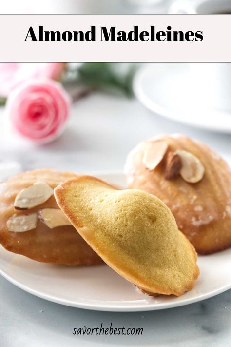 Indulge in the simple elegance of Almond Madeleines. These delightful French treats bring together the nutty goodness of almonds with a delicate crumb, making them the perfect companion for your coffee or tea. Ideal for both special occasions and everyday snacking, this Almond Madeleine recipe is a timeless classic with a nutty twist. Pin this almond madeleine cookie recipe now for a sophisticated treat you can easily whip up at home! Almond Madeleines, Madeleine Cookies Recipe, Madeline Cookies Recipe, French Madeleines, Madeline Cookies, Almond Glaze, Madeleine Recipe, Spiced Almonds, Madeleine Cookie