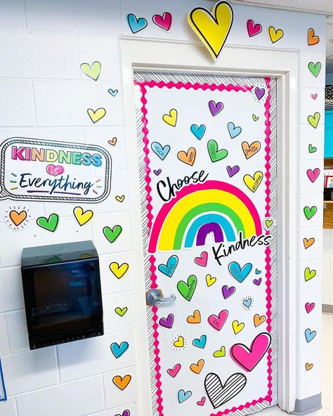 J E S S I C A • H U R S H on Instagram: “About a month ago, I got to completely revamp my classroom with a new decor line called, Kind Vibes from @carsondellosa ! Today, I’m going…” Classroom Door Rainbow, Kind Vibes Classroom Theme, Rainbow Classroom Door Ideas, Rainbow Door Decorations Classroom, Rainbow Bulletin Board Ideas, Preschool Classroom Themes, Preschool Door, Kindness Bulletin Board, Rainbow Door