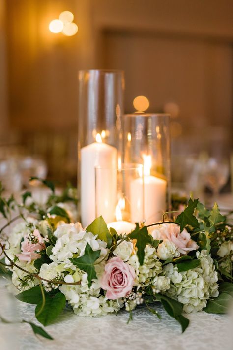 Flowers Around Candle Centerpiece, Flower Centerpiece With Candles, Short Flower Arrangements Wedding, Flowers With Candles Centerpieces, Floral Wreath Table Centerpieces, Round Table Wreath Centerpiece, Wedding Table Wreath, Blue Hydrangea Centerpieces With Candles, Hydrangea And White Roses Centerpiece