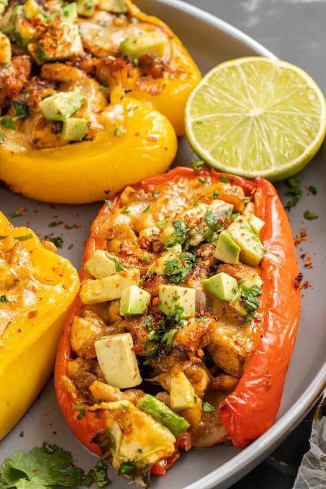 These Chicken Fajita Stuffed Peppers are perfect for an easy weeknight meal! They're packed with flavor, and best of all, they're low carb and healthy. Plus, they're perfect for feeding a large crowd. | chicken fajita stuffed peppers low carb | chicken fajita stuffed peppers recipe | chicken fajita stuffed bell peppers | fajita inspired chicken stuffed peppers | healthy chicken fajita stuffed peppers Chicken Fajita Stuffed Bell Peppers, Fajita Stuffed Bell Peppers, Chicken Stuffed Peppers Healthy, Stuffed Peppers Low Carb, Chicken Stuffed Bell Peppers, Peppers And Chicken, Stuffed Bell Peppers Chicken, Fajita Chicken, Burger Salad