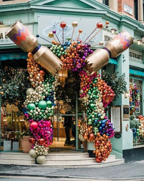 Early Hours London Ltd on Instagram: "| SAN CARLO MANCHESTER • Christmas decoration for @sancarlorestaurants • An @earlyhoursltd design & installation • Spreading festive cheer on the streets of Manchester with this enormous cracker showering a rainbow of thousands of baubles over the entrance at @sancarlorestaurants 🎄 Photo @ayeshaphoto #earlyhoursltd #christmasdecor #manchesterstreets #christmasdecorations #eventflorist #eventdecorator #visitmanchester #instachristmas #luxuryflorist #seas