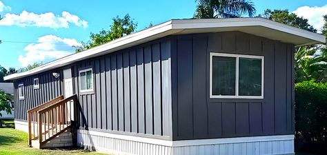 Modern Mobile Home Exterior, Painting A Single Wide Trailer Exterior, Dark Blue Mobile Home Exterior, Grey Mobile Home Exterior, Metal Mobile Home Exterior Paint, Dark Gray Mobile Home Exterior, Trailer Remodel Single Wide Exterior, Moble Homes Exterior Paint, Trailer Houses