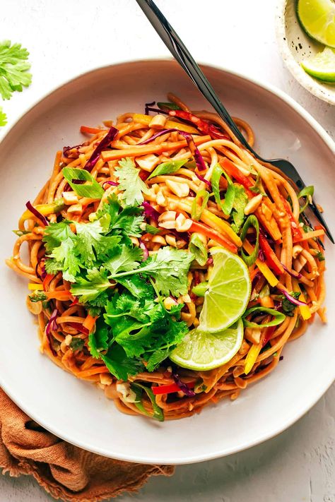 This rainbow peanut noodles recipe is made with colorful fresh veggies, your choice of noodles, and the most irresistible sesame-lime peanut sauce. Feel free to add in a protein (chicken, shrimp, beef, tofu, etc), serve warm or cold, and use whatever colorful vegetables you have on hand. Perfect for easy meal prep too! | gimmesomeoven.com Rainbow Peanut Noodles, Peanut Noodles Recipe, Chicken Shrimp, Peanut Noodles, Colorful Vegetables, Noodles Recipe, Peanut Sauce, Noodle Recipes, Easy Meal Prep