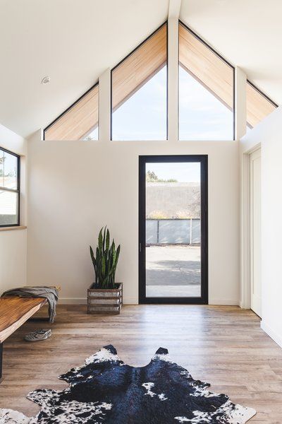 Sonoma Farmhouse by McElroy Architecture - Dwell Sonoma Farmhouse, Front Entry Interior, Triangle Window, Gable Window, Attic Doors, Trendy Door, Metal Ideas, Sonoma California, Rolling Barn Door