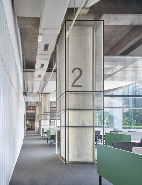 Majorel Offices - Changzhou | Office Snapshots Industrial Column Design, Office Pillar Design, Avroko Design, Column Design Interior, Columns Interior, Industrial Style Office, Column Cladding, Cladding Design, Lounge Interiors