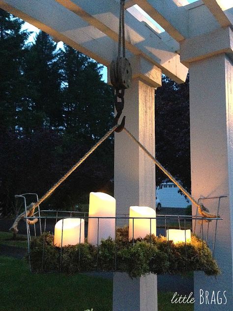 Cool outside battery candles in an old wire basket on an antique pully Hanging Wire Basket, Deco Champetre, Outdoor Chandelier, Diy Outdoor Decor, Wire Basket, Diy Hanging, Hanging Wire, Wire Baskets, Porch Patio