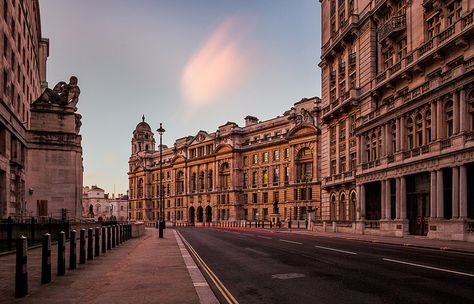 Elegant buildings line the street opposite the Ministry of Defense in Whitehall, London. Grand Buildings, Bored Of Life, Whitehall London, Westminster Bridge, London Pictures, London Hotels, Westminster Abbey, Beautiful Sights, London Eye