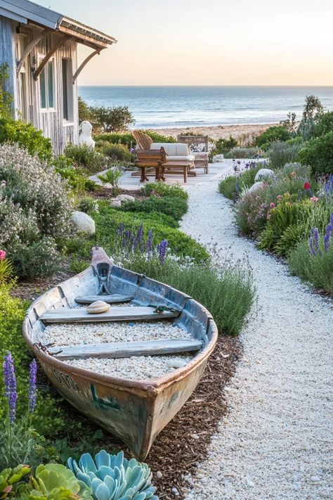 The Ultimate Guide To Creating A Stunning Coastal Home - Edward George Small Beach Garden Ideas, Seaside Garden Coastal Cottage, Coastal Yard Landscaping, Coastal Vegetable Garden, Coastal Garden Design, Driftwood Garden Ideas, Repurposed Boat, Wilderness Garden, Seaside Garden Ideas