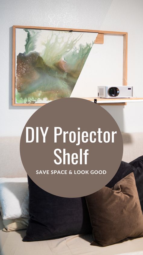 Looking for a clever solution to keep your projector out of sight when not in use, without sacrificing style or function? Look no further than this awesome DIY fold-down shelf that doubles as beautiful artwork! In this step-by-step tutorial, we'll show you how to create a custom fold-down shelf that's perfect for housing your projector, while also showcasing your favorite artwork or photos. With easy-to-follow instructions and affordable materials, this project is a great way to add some flair How To Hide Projector, Projector Over Bed, Projector Shelf Above Bed, Projector Shelf Ideas Living Room, Projector Setup Ideas Living Room, Projector Shelf Ideas, Bedroom Projector Setup, Projector Shelf, Projector In Bedroom