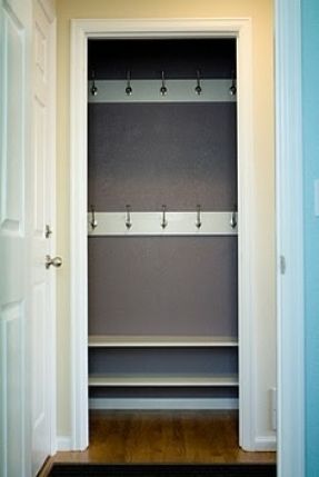 entry closet turned mudroom - with one long row of hook placed 3/4 way up the wall, shelf above with baskets, bench seating with shoe storage below and a "SKWIRA" photo art sign in the middle Closet Turned Into Mudroom, Coat Closet Organization Front Entry, Coat Closet Makeover, Mini Mudroom, Small Coat Closet, Front Hall Closet, Small Mudroom, Front Closet, Mudroom Closet