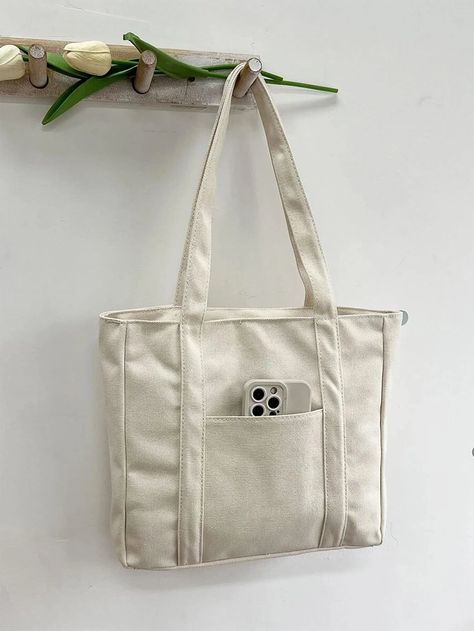 Effortless elegance with utility, this tote bag design has it all. Minimalist Tote Bag, Preppy Bags, Canvas Bag Design, Minimalist Tote, Tote Bag With Pockets, Diy Bag Designs, Printed Canvas Tote Bag, Diy Tote Bag, Fabric Tote