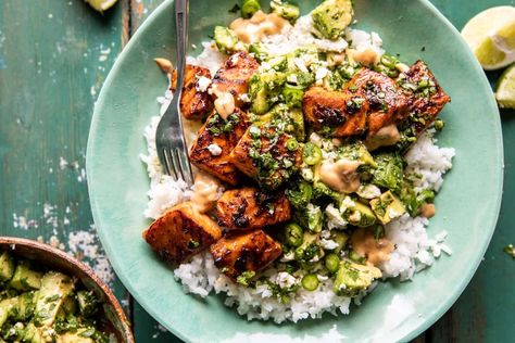 Spicy Chipotle Honey Salmon Bowls | halfbakdharvest.com Spicy Chipotle Honey Salmon Bowls, Chipotle Salmon Bowl, Chipotle Salmon, Salmon Bowls, Chipotle Bowl, Easy Suppers, Honey Salmon, Salmon Tacos, Cilantro Lime Sauce