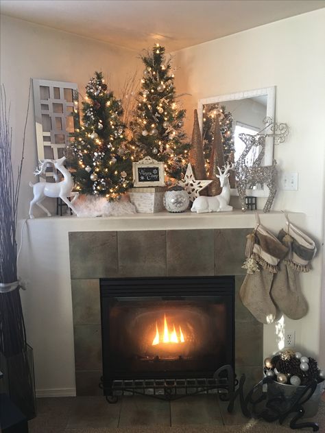 Warm and Cozy Corner Mantle Christmas Decor. Reindeer White Silver Gold Christmas Decor Corner Fireplace, Christmas Corner Fireplace Mantels, Corner Mantel Decor, Corner Fireplace Christmas Decorations, Corner Fireplace Mantel Decor, Christmas Corner Fireplace Decor, Corner Mantle Christmas Decor, Corner Mantle Ideas, Christmas Corner Mantle Decor