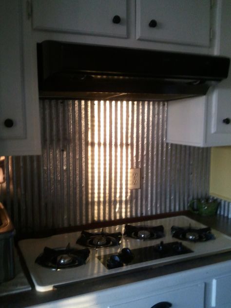 Old barn tin that we used as back splash in Kitchen behind sink and stove. Corrugated Tin Backsplash, Tin Backsplash Kitchen, Metal Backsplash Kitchen, Rustic Metal Decor, Trendy Kitchen Backsplash, Brick Backsplash Kitchen, Barn Tin, Corrugated Tin, Tin Kitchen