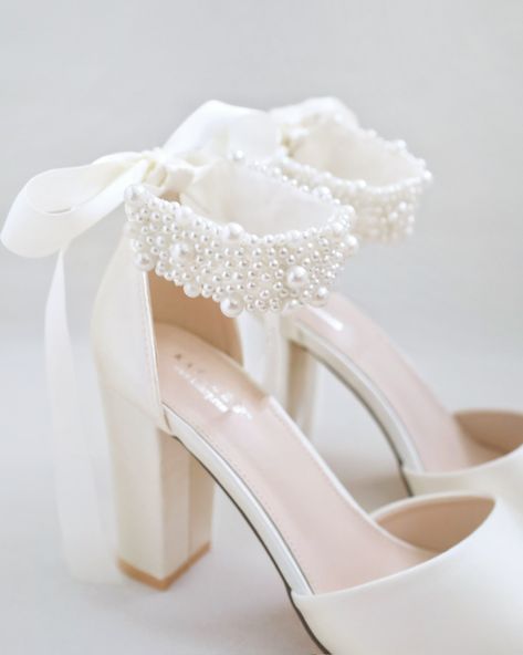 Satin block heel wedding sandals adorned with all over pearls ribbon strap. Elegance and feminine inspired wear for your special day. The delicate pearl beads are placed to create a graceful classic style. Simple and easy wear for bridal wear, bridesmaids, holiday party, wedding parties, and any special occasions.DETAILS:HEELS: 3.75 inchesUPPER: Synthetic upper and liningMATERIALS: Manmade outsoleORIGIN: Imported Wedding Shoes Block Heel, Block Heels Wedding, Bride Heels, Pearl Wedding Shoes, Bridal Flats, Wedding Shoes Bride, Satin Shoes, Wedding 2025, Wedding Guest Shoes