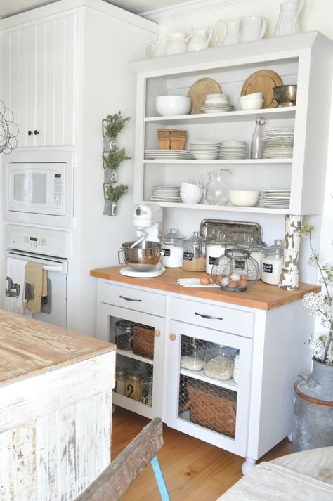 Get Inspired For Spring With This Dreamy, Rustic, White Kitchen. Buckets of Burlap farmhouse kitchen featured on Pottery Barn Blog. Open shelving. Fresh pear blooms. Baking station. White kitchen, rustic farmhouse kitchen White Kitchen Rustic, Rustic Farmhouse Kitchen Cabinets, Rustic Country Kitchens, Barn Kitchen, Rustic Kitchen Cabinets, French Country Kitchens, Farmhouse Kitchen Cabinets, Unfortunate Events, Rustic Farmhouse Kitchen