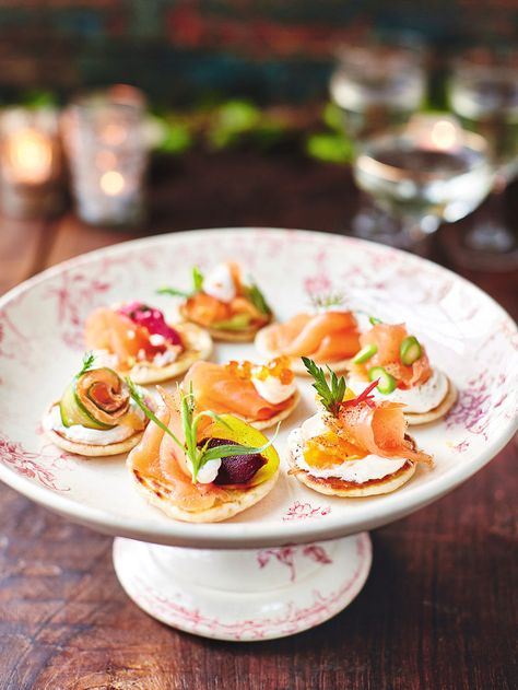 Smoked salmon blinis recipe | Jamie Oliver recipes Jamie Oliver Christmas, Salmon Blinis, Smoked Salmon Blinis, Christmas Party Food Ideas, Canapes Recipes, Pancake Toppings, Christmas Cookbook, Jamie Oliver Recipes, Party Food Ideas