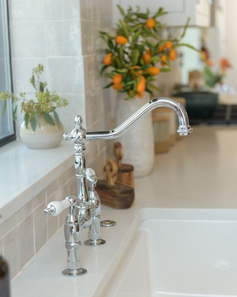 A bridge faucet is the perfect complement to a farmhouse sink. Sink Faucets Kitchen, Farmhouse Kitchen Sink Faucet, Farm Sink Faucet, Cast Iron Farmhouse Sink, Old Style Kitchen, Kitchen Cabinets Home Depot, Farmhouse Faucet, Farmhouse Sink Faucet, Stainless Steel Farmhouse Sink