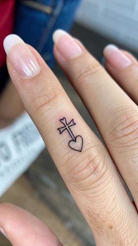 Show your love and faith with a beautiful cross with interlocking hearts tattoo design. Perfect for couples and individuals who want to showcase their devotion to God and each other. #ChristianTattoos #CrossTattoo #HeartTattoo #FaithAndLove #TattooInspiration Interlocking Hearts Tattoo, Christian Tattoo Ideas, Hearts Tattoo, Christian Tattoo, Love And Faith, Interlocking Hearts, Heart Tattoo Designs, Beautiful Cross, Cross Tattoo