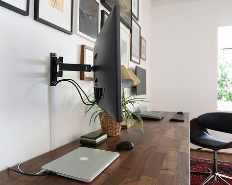 Tips to hide electronic cords in an office. Office Mounted Monitor, Wall Mounted Tv Monitor, Monitor On Wall Home Office, Office With Monitor On Wall, Home Office Monitor On Wall, Mounted Computer Monitor Offices, Cord Management Desk, Wall Mounted Monitor Desk, Desk Mounted To Wall