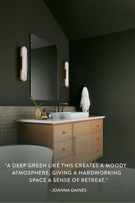 A bold paint color, like Locally Grown from Magnolia Home by Joanna Gaines® paint, will always give your
bathroom a special and unique ambiance and transform your space into a place you'll never want to leave. Fixer Upper Welcome Home, 2021 Interior Design Trends, Magnolia Homes Paint, Moody Bathroom, Porch Paint, White Tub, Flat Panel Cabinets, Vintage Light Fixtures, Traditional Fireplace