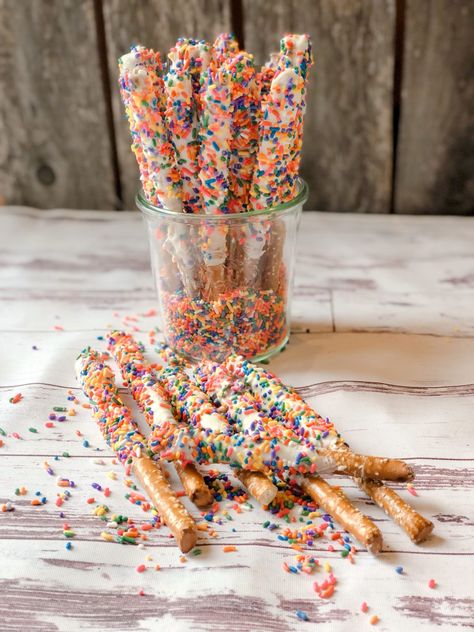 Snacks With Sprinkles, White Chocolate Dipped Pretzels, Birthday Cake Dip, Chocolate Pretzels Sticks, White Pretzels, Chocolate Dipped Pretzel Rods, Rainbow Popcorn, White Chocolate Covered Pretzels, Dipped Pretzel Rods