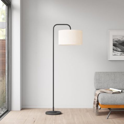 This sleek lamp pairs a streamlined design with retro inspiration and TBH, we're pretty obsessed with it. It's made from metal with a round base and has a straight body that ends in a right-angled arm for a clean look. At the end of the arm, this fixture features a hardback linen drum shade that adds to the retro look. This lamp accommodates a single 100 W bulb (not included). But the best part? It's powered by a footswitch, so you can easily turn it on, even when your hands are full. Floor Lamps Living Room Ideas, Living Room Floor Lamp, Bronze Natural, Floor Lamps Living Room, Arched Floor Lamp, Mid Century Modern Lighting, Contemporary Floor Lamps, Wayfair Furniture, Black Floor Lamp