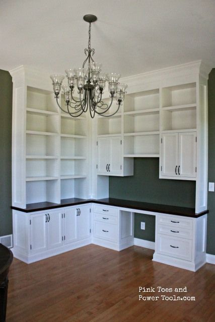 This L-shaped built-in offers lots of space and is accented by the black counter. Office Built Ins Corner, Corner Built In, Home Office Built Ins, Office Built Ins, Dream Craft Room, Dining Room Home Office, Craft Room Office, Built In Desk, Sewing Rooms