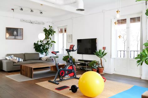 Home Gym Family Room Combo, Dining Room Gym, Family Room Gym Combo, Family Home Gym, Home Gym Living Room Combo, Home Gym In Living Room, Style A Tv Console, Treadmill In Living Room, Decorate A Tv Console