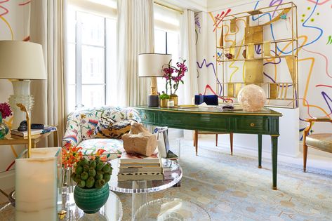 For his Kips Bay debut, designer Phillip Thomas used a Maison Jansen commode and desk — from Bernd Goeckler and Maison Gerard, respectively — outfit the space, but the formality ends there. The crème-hued upholstered walls are artfully defaced with swirls of spray paint, a pink sheep peeks out from beside the commode, and the side tables, including a trio of acrylic barbell pieces from Lorin Marsh, hold an array of colorful vessels and flora. Lady Lair, Kips Bay Showhouse, Fabric Covered Walls, Show House, White Office, Eclectic Home, Home Office Design, Architectural Digest, Elle Decor