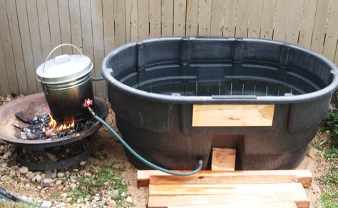 There was a great big smile on mommy's face when our 8-year-old and I unveiled the new off-grid fire heated hot tub we built her for Mother's Day. To make it, we recycled a 110 gallon water tank (c... 1000 Lifehacks, Outdoor Hot Tub, Diy Hot Tub, Outdoor Bathtub, Outdoor Tub, Hot Pools, Stock Tank Pool, Outdoor Bath, Stock Tank