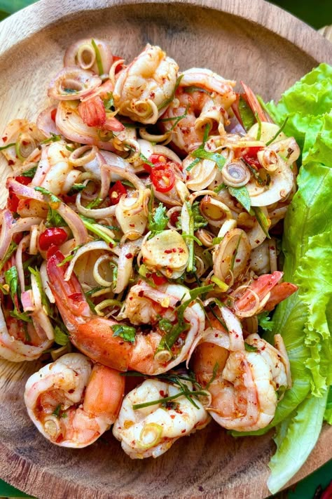 Try the Spicy Thai Shrimp Salad for a light and refreshing meal. It's loaded with healthy veggies and fresh herbs, dressed in a zesty Thai dressing, perfect for summer. Spicy Thai Shrimp Salad, Seafood Salads Cold, Asian Seafood Salad, Asian Summer Food, Thai Shrimp Appetizer, Thai Shrimp Spring Rolls, Shrimp Thai Salad, Summer Thai Recipes, Thai Seafood Recipes