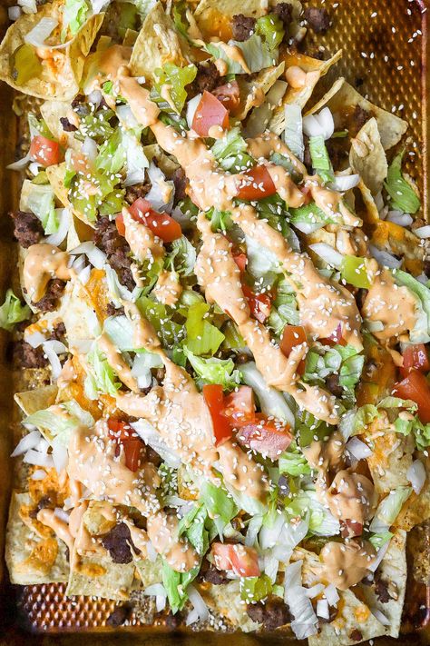 Top down view of easy homemade cheeseburger nachos with fresh lettuce and tomatoes. Big Mac Nachos Recipes, Big Mac Nachos, Cheeseburger Nachos, Nachos Recipes, Recipe With Ground Beef, Homemade Cheeseburgers, Top Down View, Nachos Recipe, Big Mac