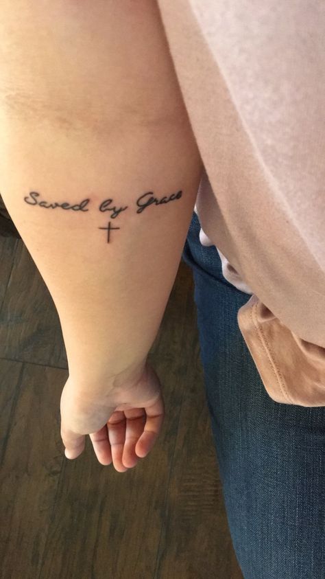 Saved by Grace💜✝️ Saved By His Grace Tattoo, Saved By Grace Tattoo With Cross, Saved By Grace Tattoos For Women, Jesus Saves Tattoo, Saved By Grace Tattoo, Holy Tattoos, Grace Tattoo, Small Symbol Tattoos, Scripture Tattoos