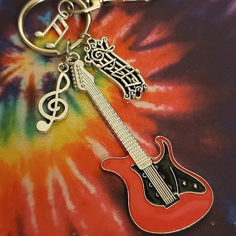 Please See All Details And Photos Before Purchasing: -Handmade By Me New No Tags -All Charms Made Of Metal (Guitar Has A Little Weight) -Has Lobster Clasp And Key Ring For Versatile Use -Guitar Charm Measures 2.69 Inches -Keychain Length From Top Of Clasp To Bottom Of Guitar Hangs 5 Inches Great Gift For Musicians And Guitarists, Or An Accessory For Purses, Belt Loops Etc. Tags: Edc, Edm, Rave, Music Festival, Guitar, Guitar Earrings, Guitarist, Music, Musician, Dj, Rock, Punk, Metal, Rock N Rol Punk Rock Earrings, Keychain Music, Guitar Earrings, Rock Earrings, Vintage Keychain, Black Guitar, Metal Guitar, Rave Music, Edm Rave