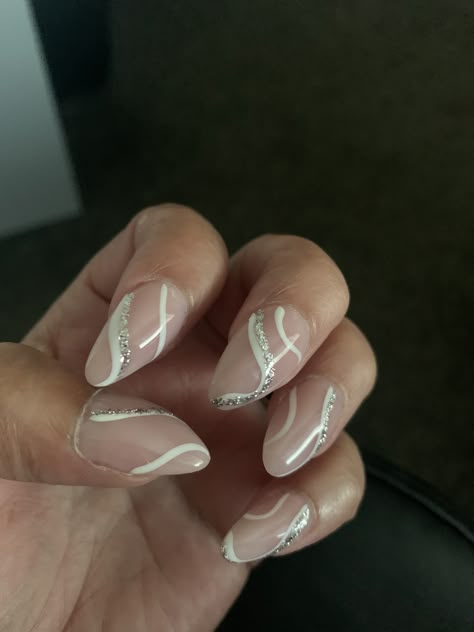 White And Silver Acrylic Nails Prom, Sliver Homecoming Nails, White Silver Swirl Nails, White And Glitter Swirl Nails, Silver Nails Ideas Almond, Glitter Swirl Acrylic Nails, Neutral Prom Nails Acrylic, Nails To Go With A Silver Dress, Homecoming Nails Acrylic Almond