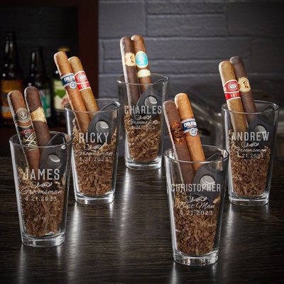 Cigars are smoked to commemorate major milestones. Asking someone to join your wedding party is one of those milestones. These cigar groomsmen gifts have a black cigar cutter that will work great on any cigar and a custom pint glass that can be filled with whatever beer goes great with the cigars your groomsmen will be enjoying. Each pint glass is engraved individually for each groomsman so they’ll each receive a unique gift they will love. Cigars are not included, so tossing in one or two is a Groomsmen Kit, Home Wet Bar, Groomsmen Gifts Unique, Groomsmen Gift Set, Gifts Set, Beer Custom, Groomsmen Proposal, Wedding Groomsmen, Groomsmen Gifts