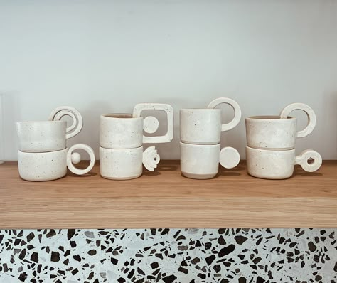 Sturdy ceramic espresso cups, sake cups, and/or shot glasses. Hand-thrown with white clay and glazed with oatmeal (off-white) glaze that allows the natural speckles in the clay to show through. Mugs are stackable, but due to the unique handles, they must be stacked in a particular way. This order is for the complete set of 8 mugs - each unique and special. Microwave and dishwasher safe.  Note: sizes vary. Each cup holds 3-4 oz. Please note that all of the pottery in my shop is hand-made and glaz Glass Pottery, Pottery Unique, Ceramic Mug Set, Pottery Sets, Espresso Mug, Coffee Cup Ceramic, Pottery Set, Coffee Ceramic Set, Stackable Ceramics