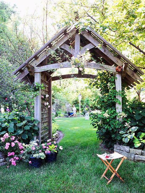 An arbor serves as a beautiful portal to a backyard garden. This large arbor features posts that are 6x6 lumber--large enough to support any climbing plant. The lattice sides and top provide crawling space for flowering climbers such as roses or clematis. Side House Garden, Garden Archway, Garden Vines, Garden Arbor, Garden Arches, Garden Entrance, Splash Pad, Small Garden Design, Garden Trellis