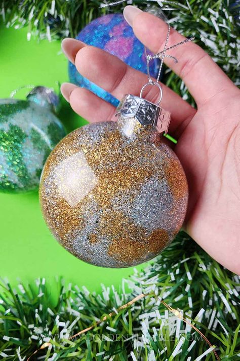 How to Make Glitter Ornaments (With Regular Glue!). Diy Glitter Ornaments With Glue, Glitter Bulbs Diy, Diy Christmas Ornaments Glitter Balls, How To Make Glitter Ornaments Diy, Ornaments With Glitter Inside, How To Decorate Clear Glass Ornaments, Homemade Ornament For Teacher, Paint In Clear Ornaments Glass Ball, Clear Xmas Ornament Ideas