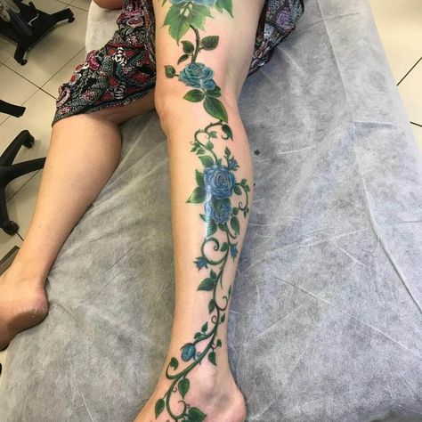 Elaborate Blue Rose Vine Tattoo For Your Entire Leg Rose Vine Tattoo, Vine Tattoo Ideas, Rose Tattoo Leg, Colorful Rose Tattoos, Most Painful Tattoo, Rosé Legs, Rose Vine Tattoos, Vine Drawing, Vine Tattoo